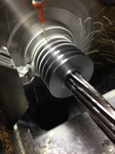 High speed lathe in action. This photo shows the CNC cutter in action. It currently has some stainless steel.