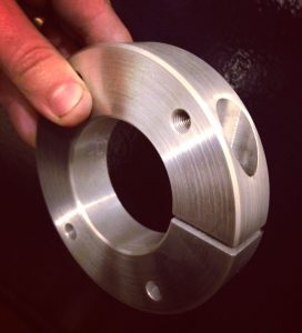 A high quality image showing a stainless steel disc that has been threaded and cut. This has been carried out by Reynolds Precision engineering using a CNC lathe.