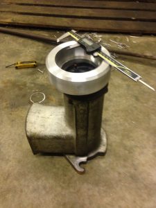 Measuring the size of the recently lathed aluminium